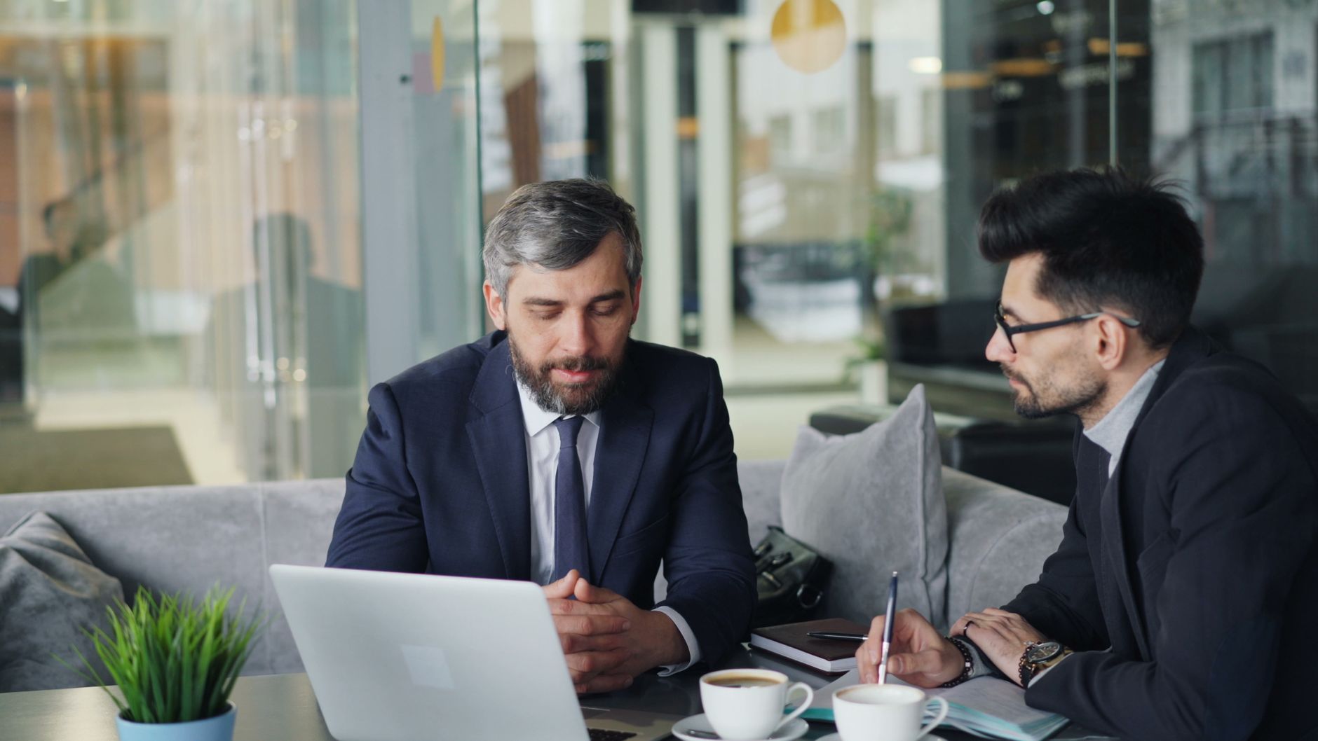 businessmen talking over coffee