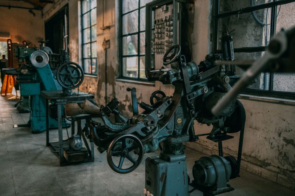 vintage industrial machines in abandoned workshop