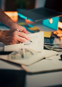 business desk with financial documents and cash