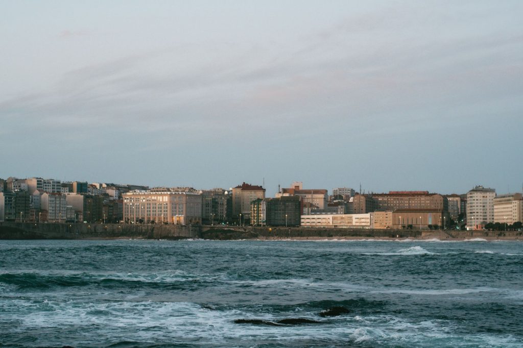 seaside cityscape at dusk with urban skyline