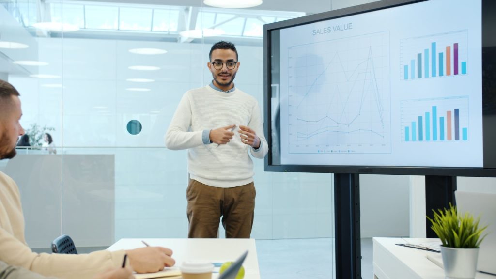 young professional presenting business analytics