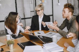 businesspeople brainstorming in conference room