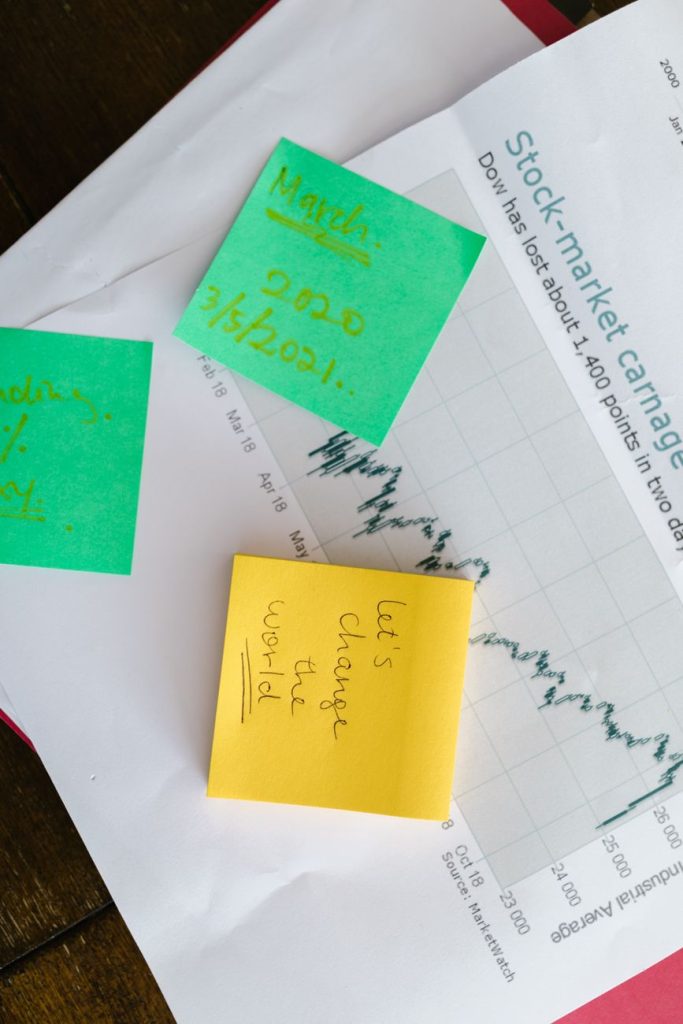 yellow sticky note on white paper