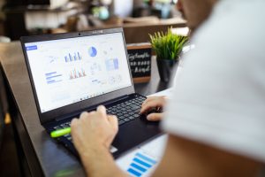 person using black and gray laptop