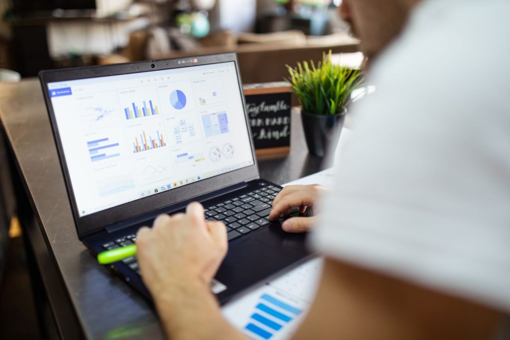 person using black and gray laptop
